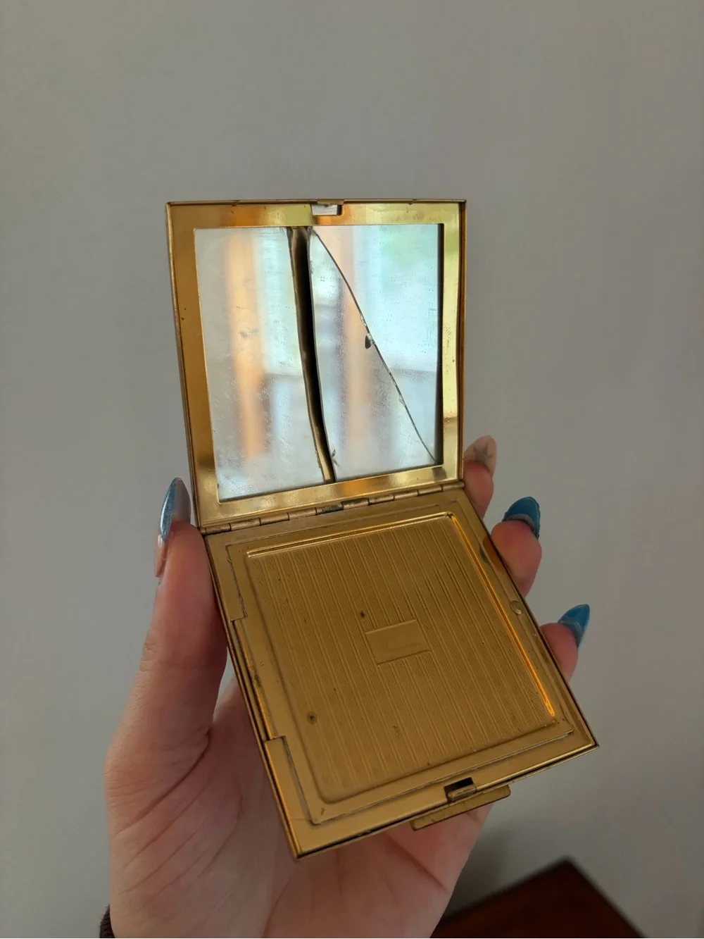 vintage Elgin American gold powder compact with an etched floral design